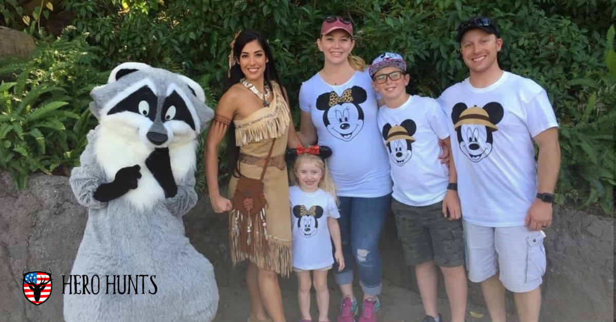 Julia and Sean M. and their children pose with Pocohantas and Meeko during their 2018 magical vacation to Walt Disney World as a family.