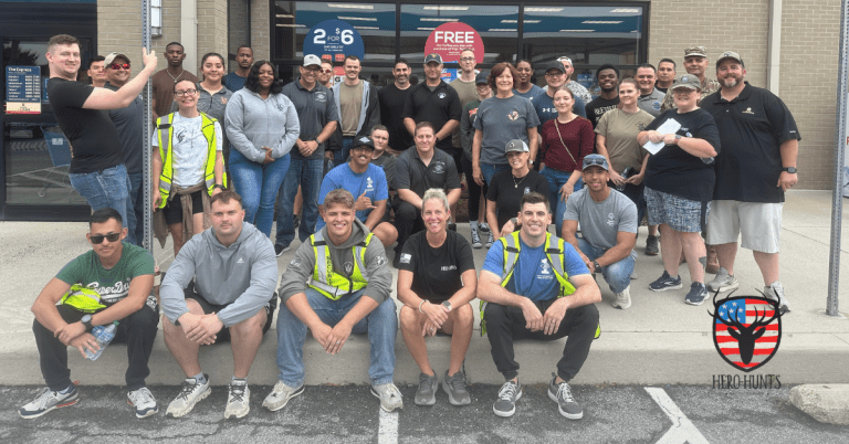 Group of volunteers posing at Fill-Your-Tank Day 2025 as a way to help American heroes