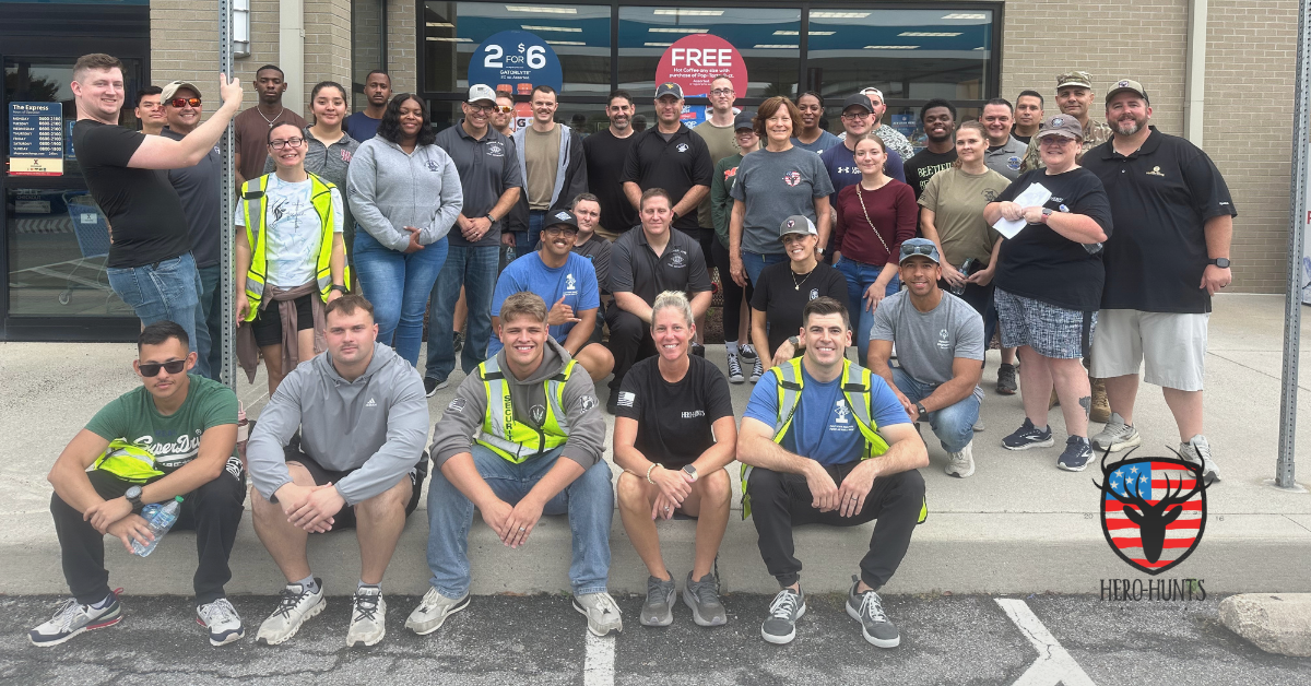 Group of volunteers posing at Fill-Your-Tank Day 2025 as a way to help American heroes